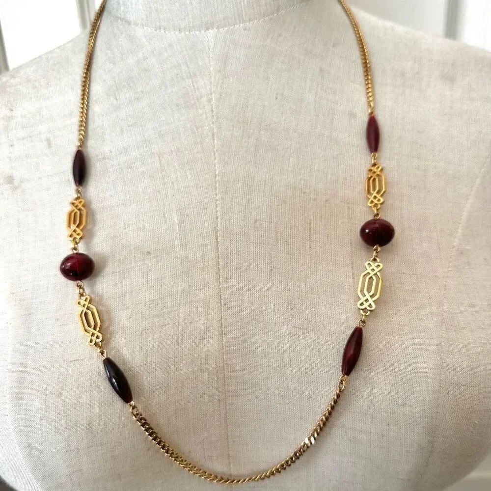 Gold tone and brown/red long beaded necklace